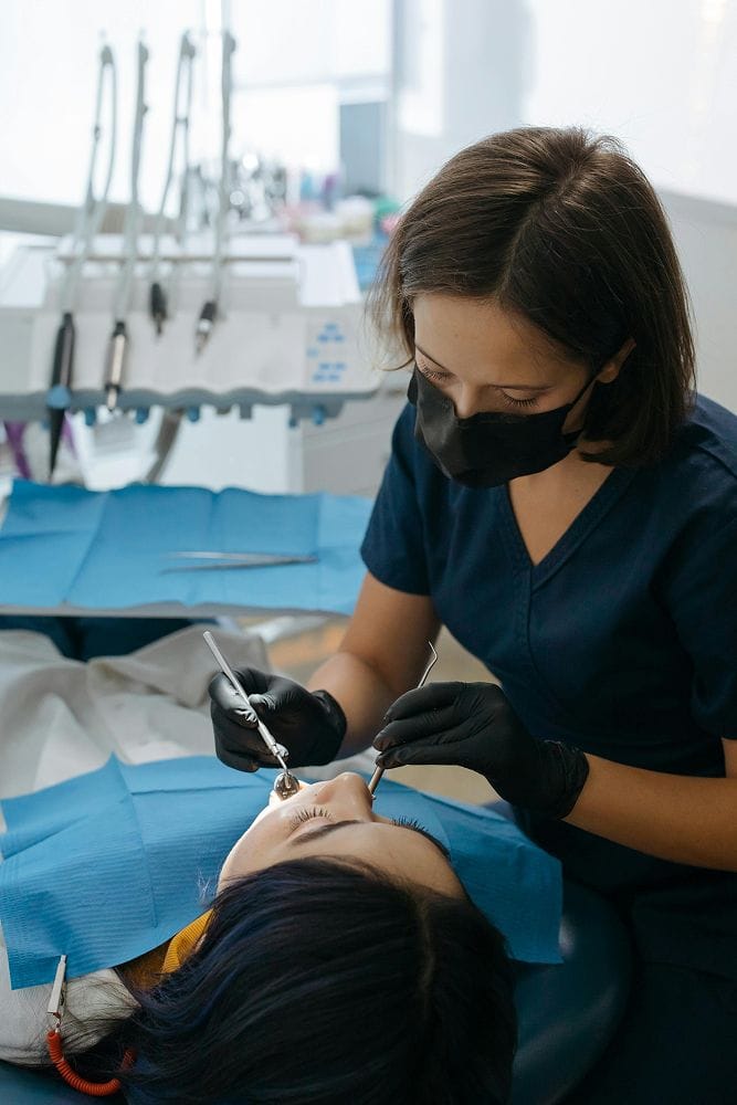 dentist treating girl patient